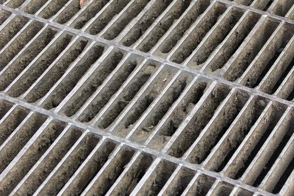 Drain grating on road in Thailand, background — Stock Photo, Image