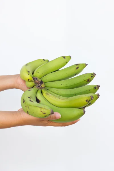 Banana w ręce kobiety na białym tle na białym tle — Zdjęcie stockowe