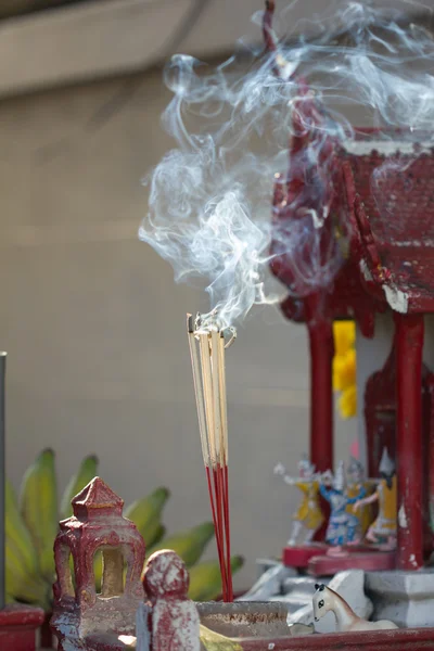 Incense sticks with smoke in front of spirit's house in Thailand — Stock Photo, Image