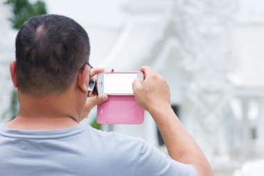 şişko bir tapınak Tayland, mobil fon ile fotoğraf çekme