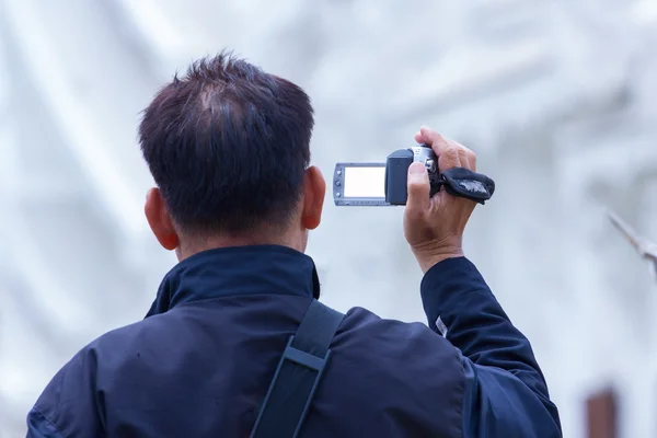 Male recording temple with digital video recorder — Stock Photo, Image