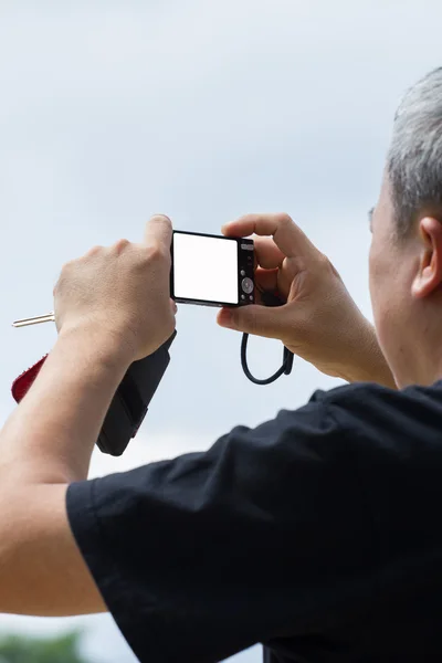 Old male taking a picture with camera — Stock Photo, Image