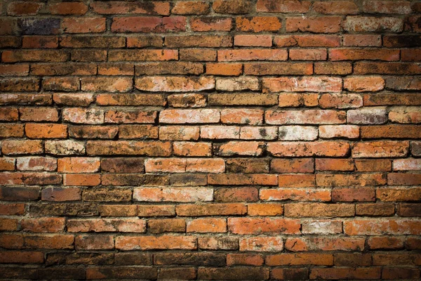 Verwitterte gefärbten alte Ziegel Wand backgroun — Stockfoto