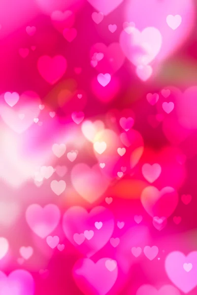 Red hearts bokeh as background — Stock Photo, Image