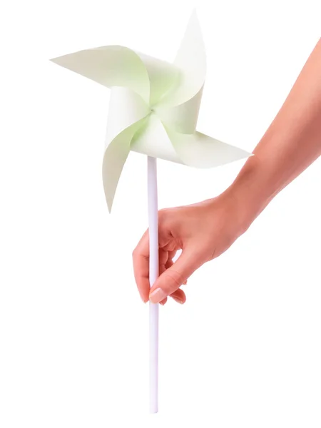 Green paper windmill in a hand — Stock Photo, Image