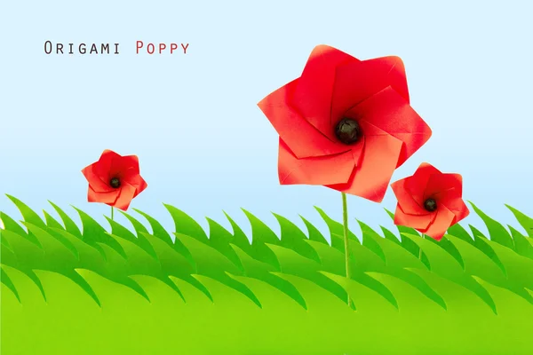 Campo verde com papoula origami — Fotografia de Stock
