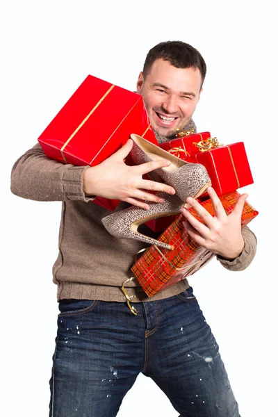 Jovem segurando presentes comprados — Fotografia de Stock