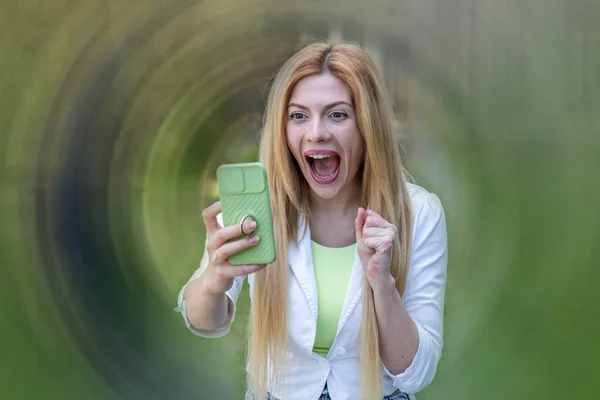 Surprised Young Woman Looks Smartphone Screams Joy Winning — 图库照片