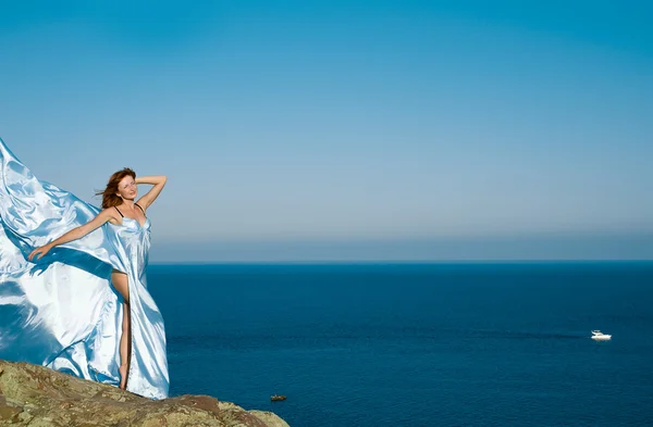 Red-haired girl in a blue dress — Stock Photo, Image