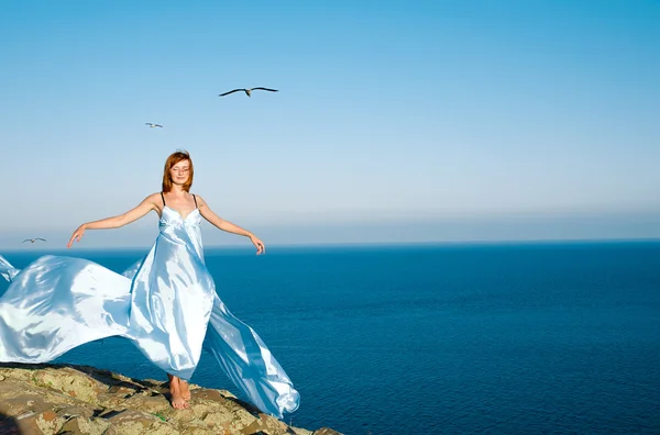 Red-haired girl in a blue dress — Stock Photo, Image