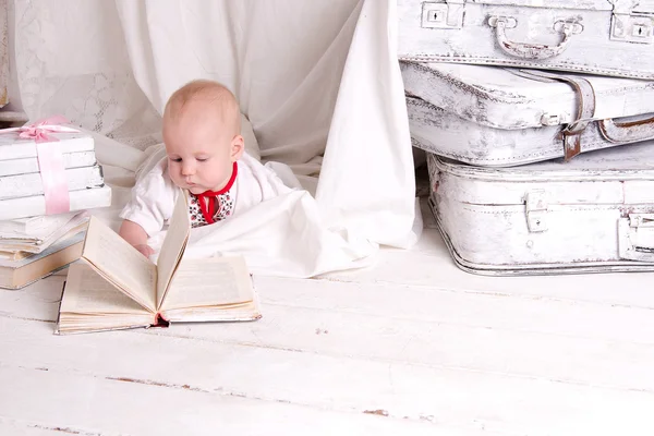 Boy on white painted floor — Stock Photo, Image