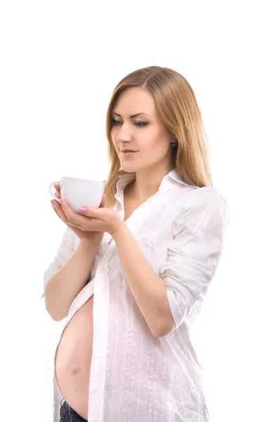 Schwangere mit Teetasse — Stockfoto