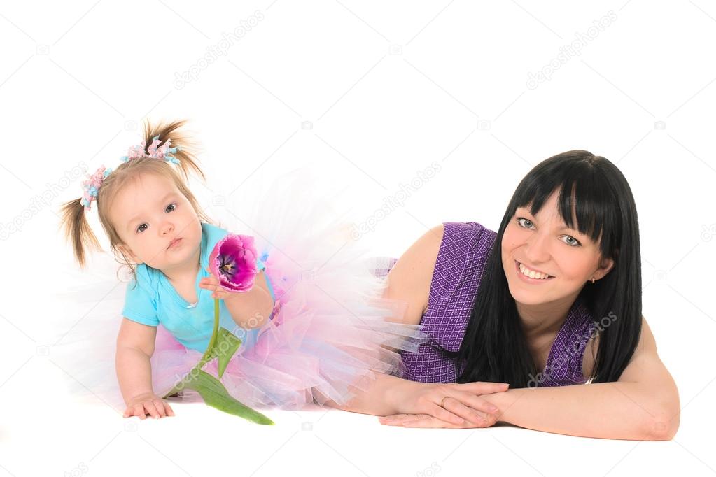 baby girl in tutu holding hands tulip for Mom