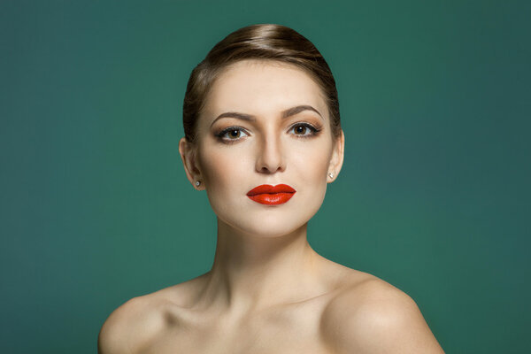 fashion portrait of a beautiful young woman with red lips