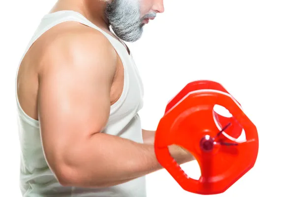 Navidad. Primer plano de los bíceps musculares de un atleta barbudo levantando una pesada barra aislada sobre un fondo blanco — Foto de Stock