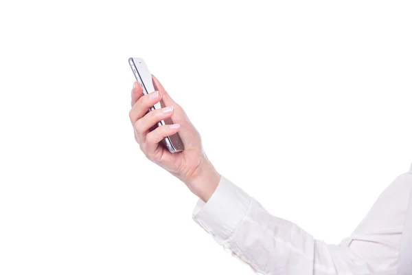 흰색 배경에 분리 된 최신 스마트폰을 들고 있는 나이든 여성 손의 근접 사진 — 스톡 사진