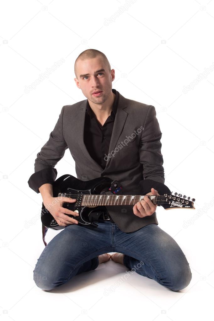 Casual guy playing guitar