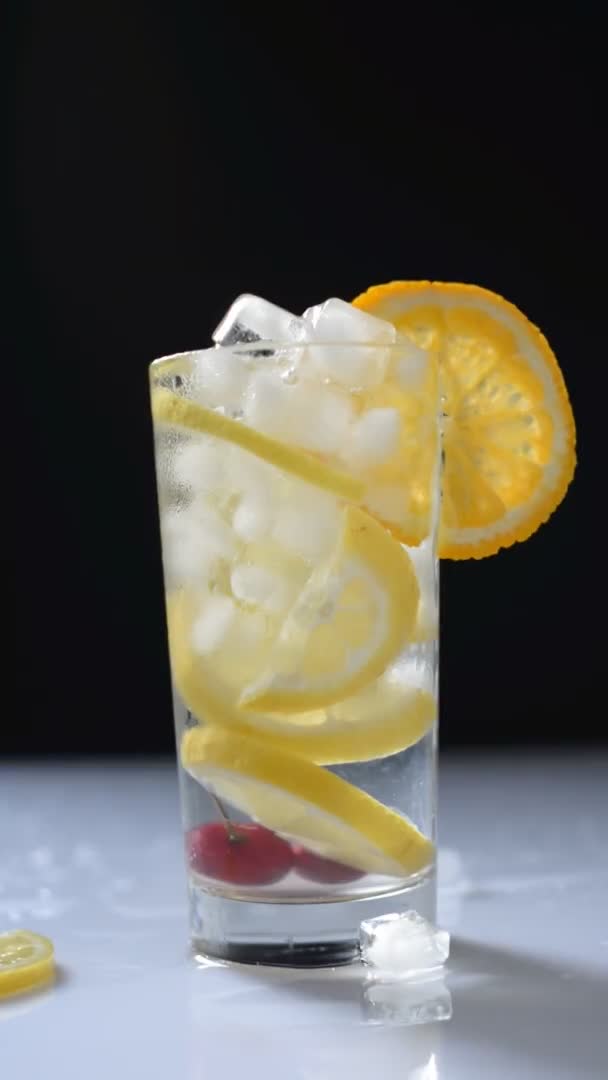 Vertical Video Cocktail Glass Lemonade Ice Black White Background — Stock Video