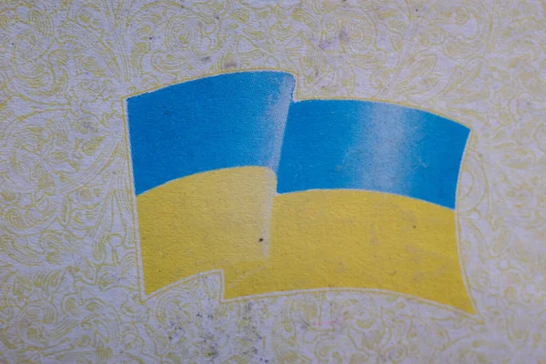 flag of ukraine in the passport logo on the pages of the old passport of a citizen of ukraine.