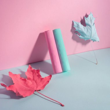 pink-blue chalk with autumn leaves paint on a blue-pink background.