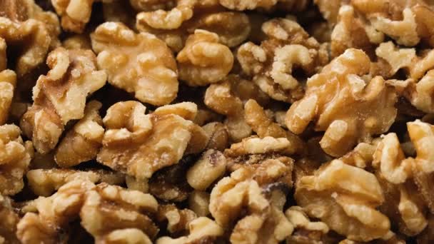 Closeup of big shelled walnuts pile. Healthy food. Rotating video. — Stock Video