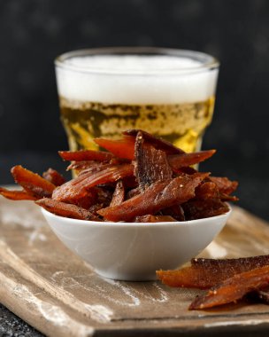 Salmon jerky Dry cured and smoked with salt and pepper served with beer or ale