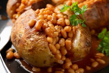 Jacket Baked potato with tomato beans. Traditional British food.