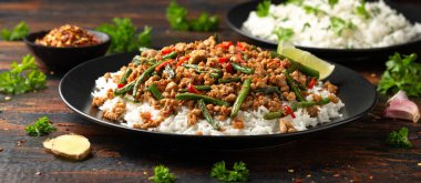 Pork Stir Fry with Green Beans, rice, garlic, chili and ginger. Asian food
