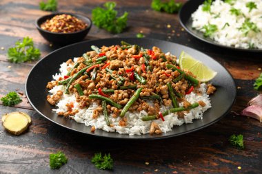 Pork Stir Fry with Green Beans, rice, garlic, chili and ginger. Asian food