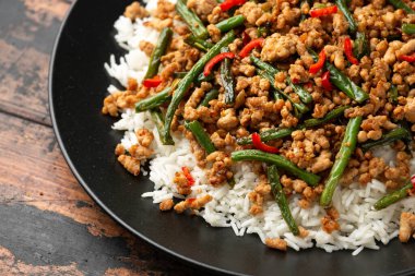 Pork Stir Fry with Green Beans, rice, garlic, chili and ginger. Asian food