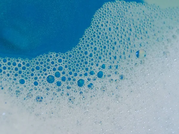 Semi-abstract picture of the pattern of white bubbles against a blue background — Stock Photo, Image