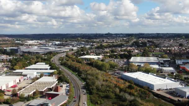 Aerial movie of a busy dual carriageway road set amongst light industry — Stock Video