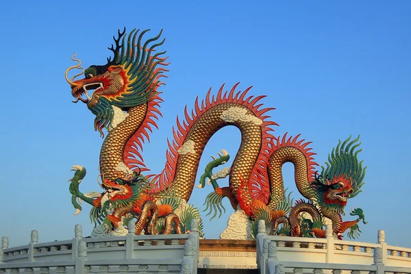 Golden dragon on beautiful sky background — Stock Photo, Image