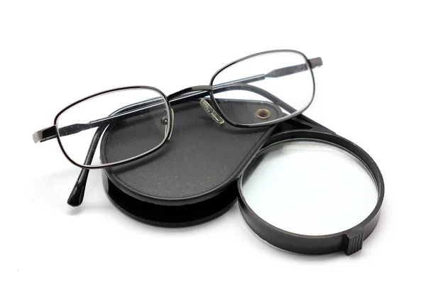 Eye glasses and magnifying glass isolated on white — Stock Photo, Image