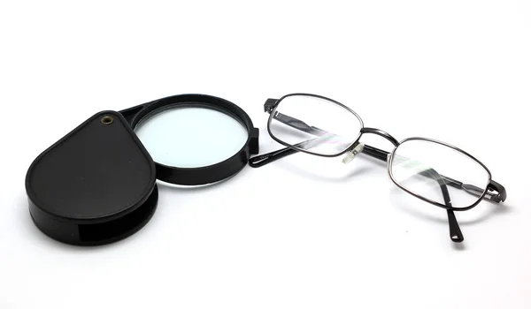 Eye glasses and magnifying glass isolated on white — Stock Photo, Image