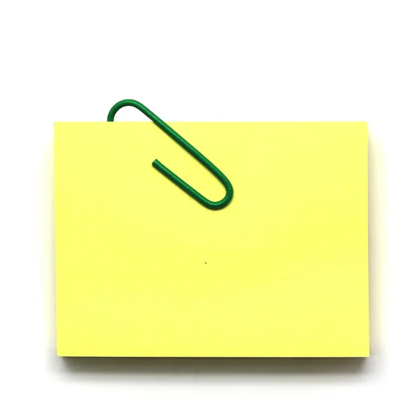 Paperclip en notepad op wit wordt geïsoleerd — Stockfoto