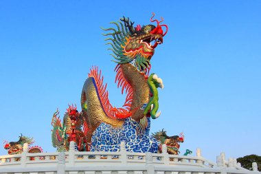 Chinese golden dragon with beautiful sky background