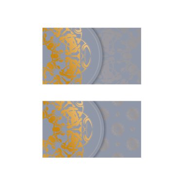 Gri kartvizitli ve markanız için soyut altın süslemeli..