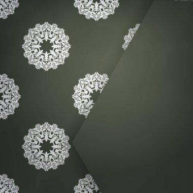 Beyaz süslemeli koyu yeşil bir broşür tipografi için hazırlandı..