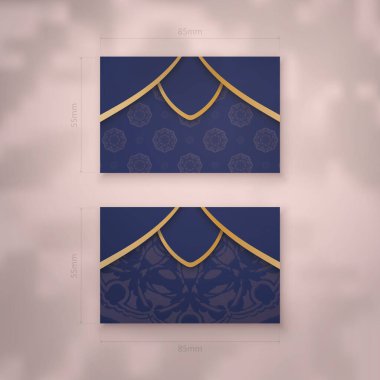 Koyu mavi bir kartvizit ve işleriniz için altın mandala süsleri..