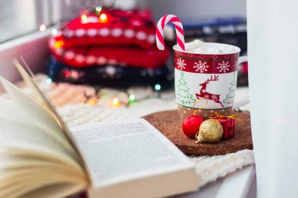Mug Coffee Deer Snowflakes Marshmallows Candy Cane Open Book Windowsill — Stock Photo, Image