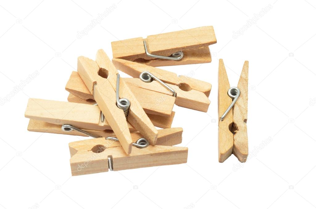 Wooden clothespins on the white background