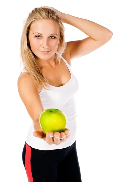 Fitness girl with green apple on white background — Stock Photo, Image