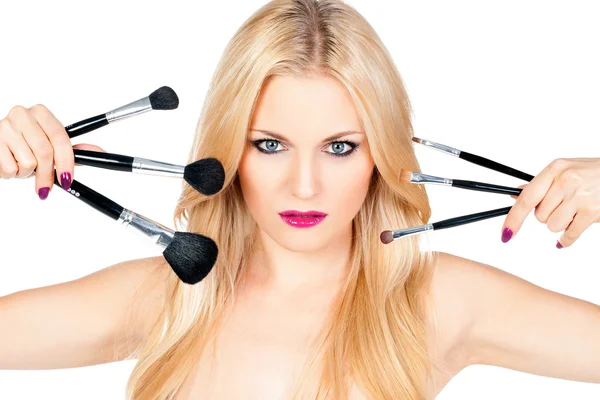 Beautiful woman with makeup brushes — Stock Photo, Image