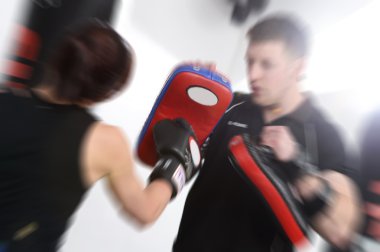 Action shot punching the pads clipart