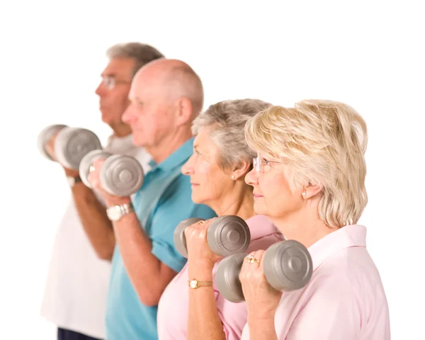Mature older people lifting weights — Stock Photo, Image