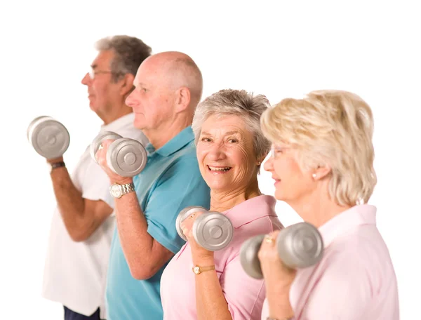 Mature older people lifting weights — Stock Photo, Image