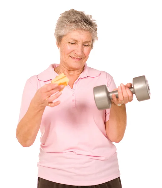 Mature older lady choosing diet or exercise — Stock Photo, Image