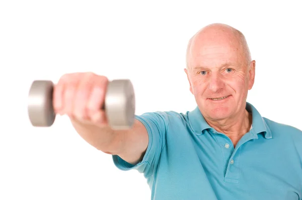 Mature older man lifting weights — Stock Photo, Image