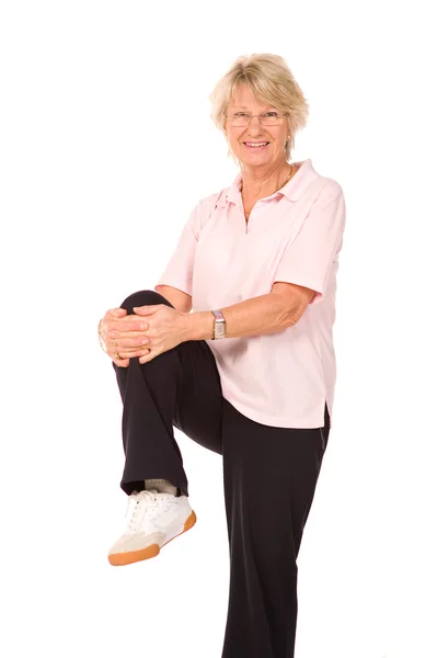 Mature older lady stretching — Stock Photo, Image